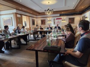 People sat around a table in a room